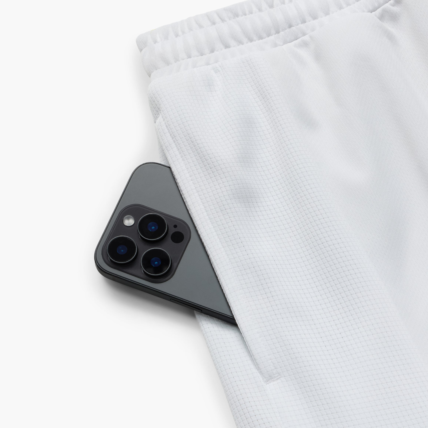 Yonex Men's Shorts YM0051CW (Cool White) phone in pocket view